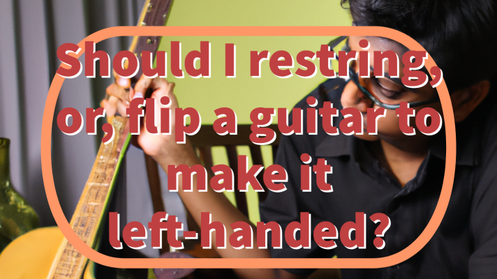 Man holding a guitar with letters that say "Should I restring or flip a guitar to make it left handed"